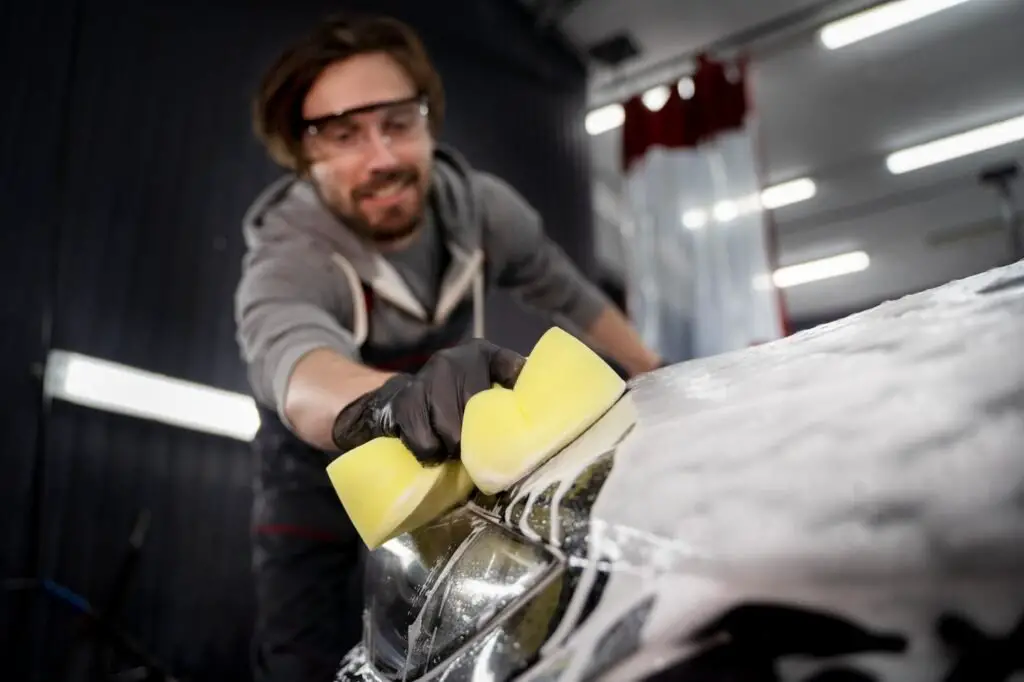 a man performing manual car wash 